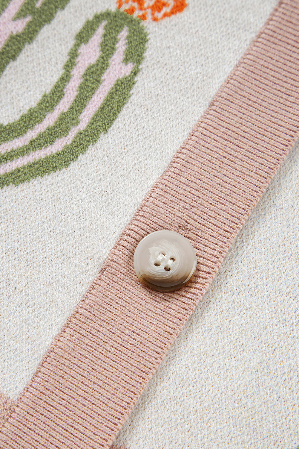 Abrikooskleurig gebreid vest met cactusprint en knoopsluiting